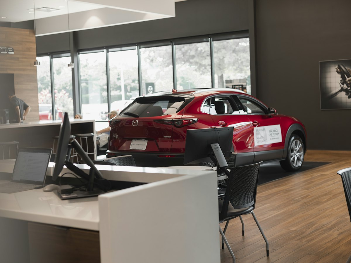 Red car in a dealership showroom
