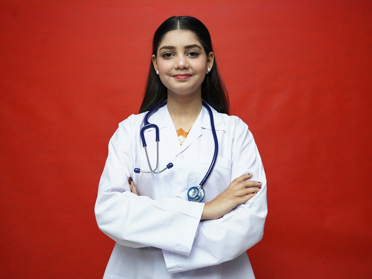 Indian woman doctor in a white coat with a stethoscope