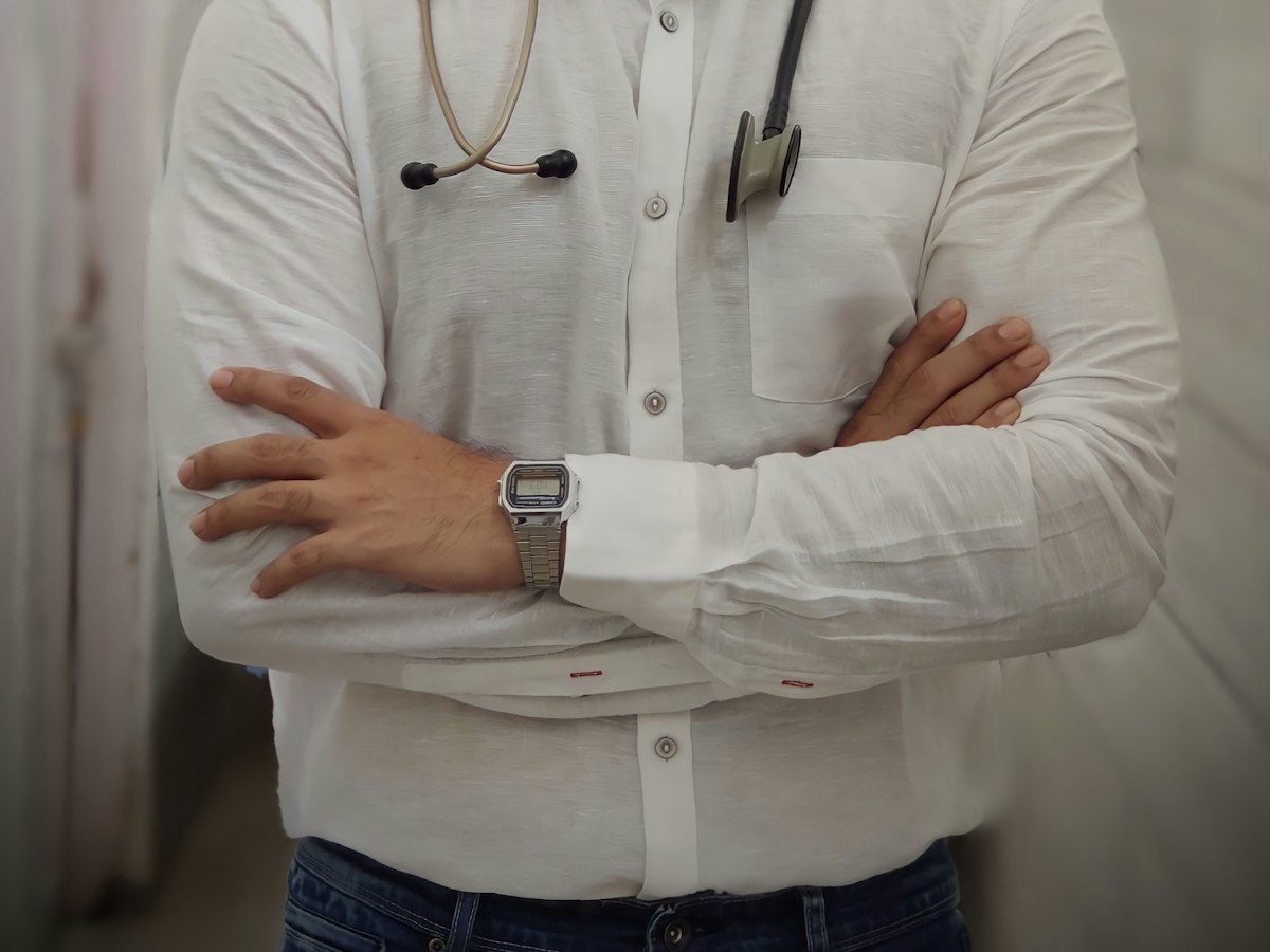 Doctor with a stethoscope and arms crossed