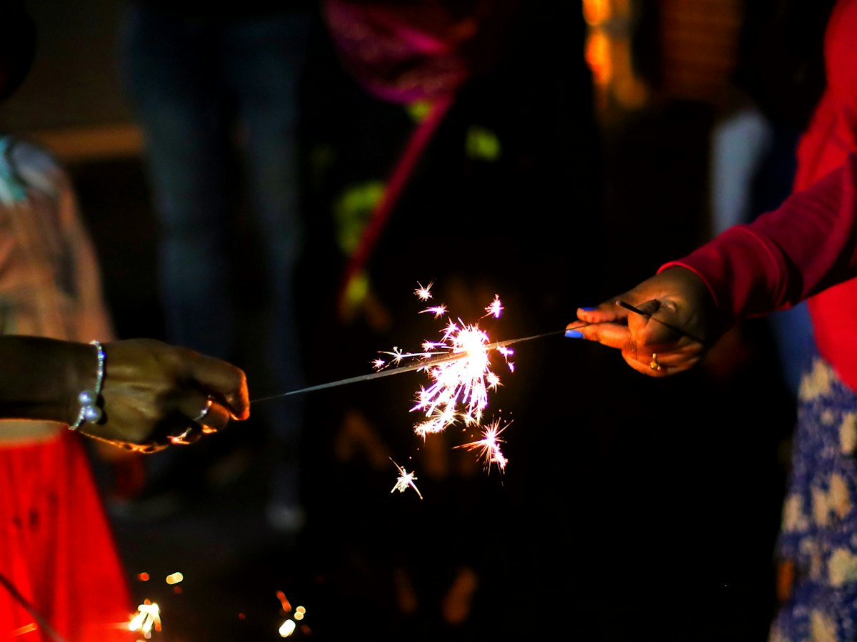 Sparklers lit during a festival night