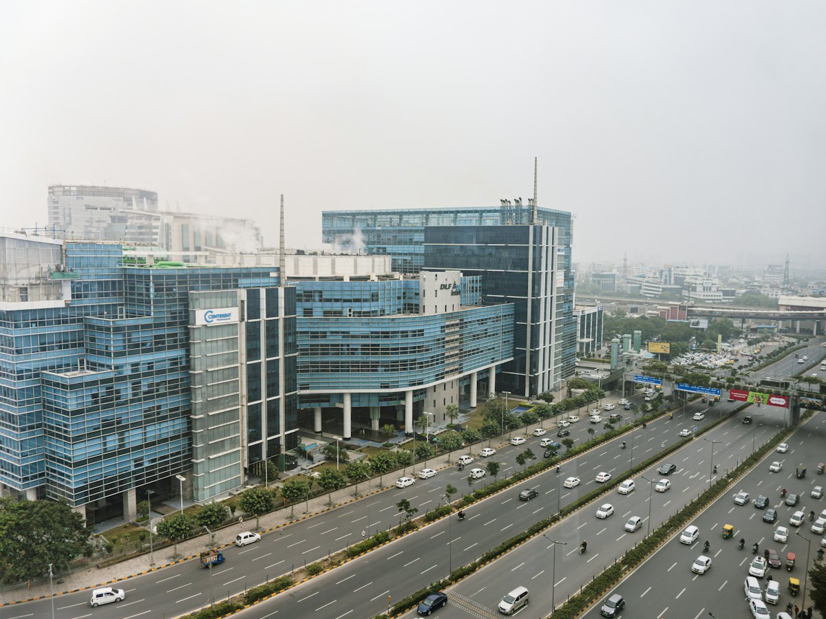 Traffic beside office towers in Gurugram
