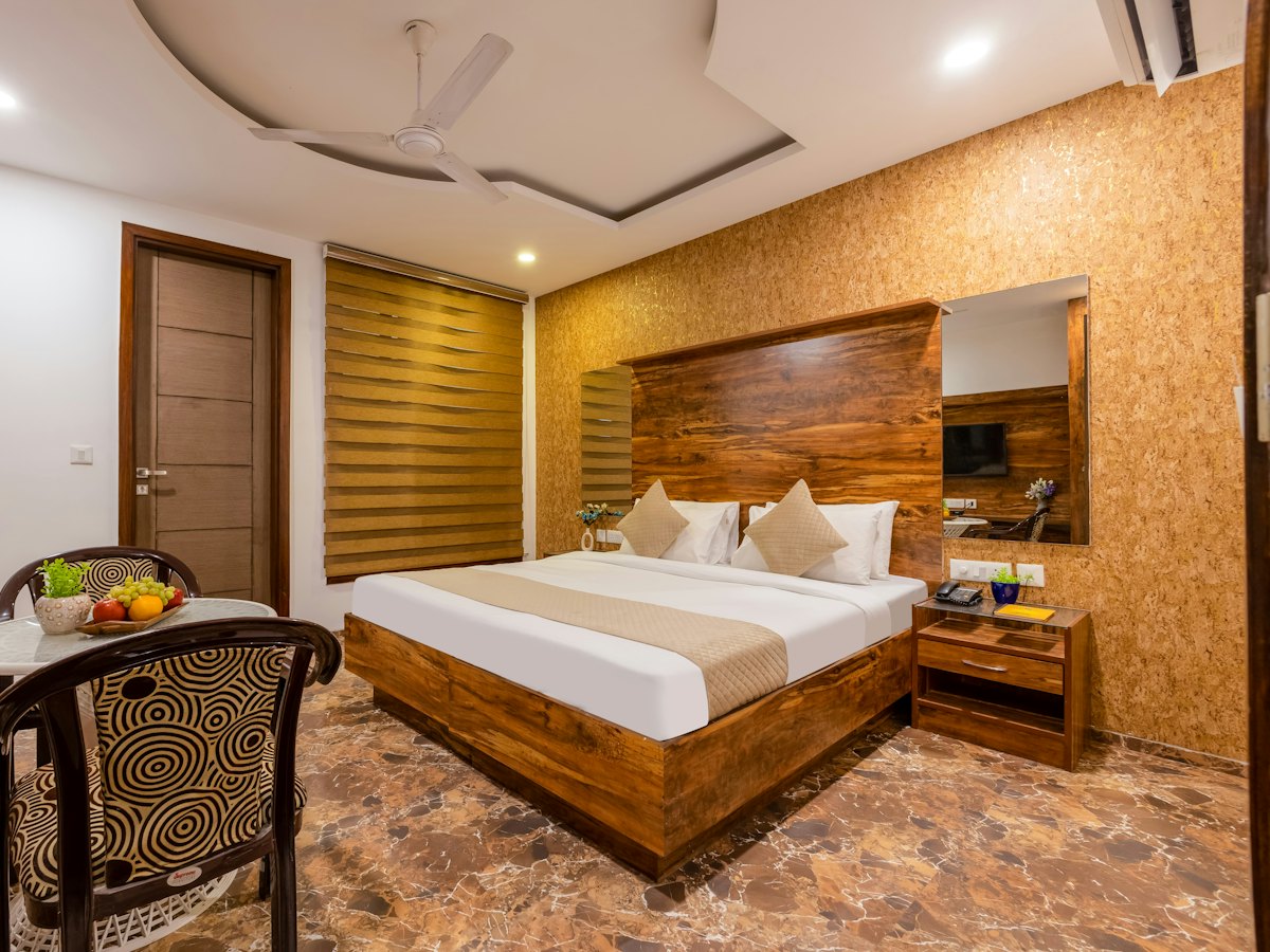 Hotel room with a wooden bed and marble floor
