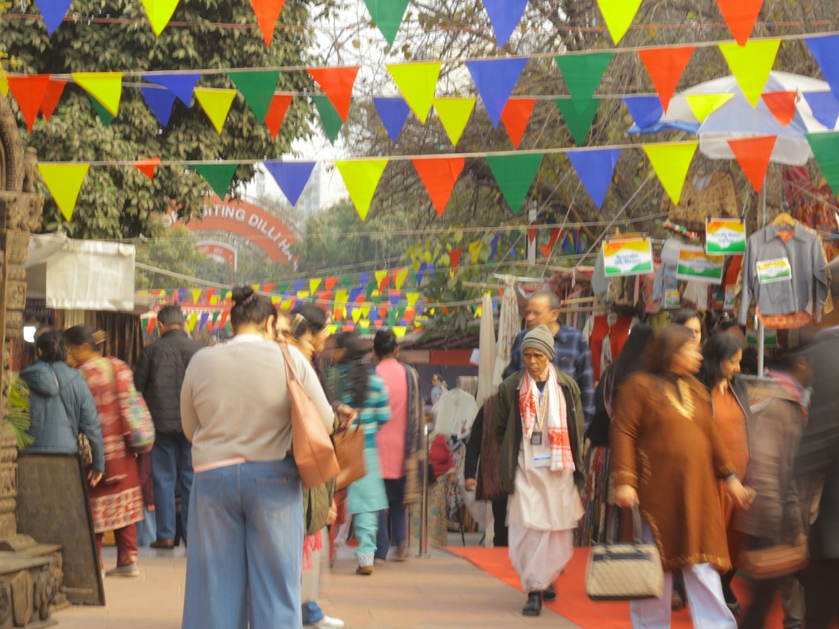 People shopping at a colourful outdoor market