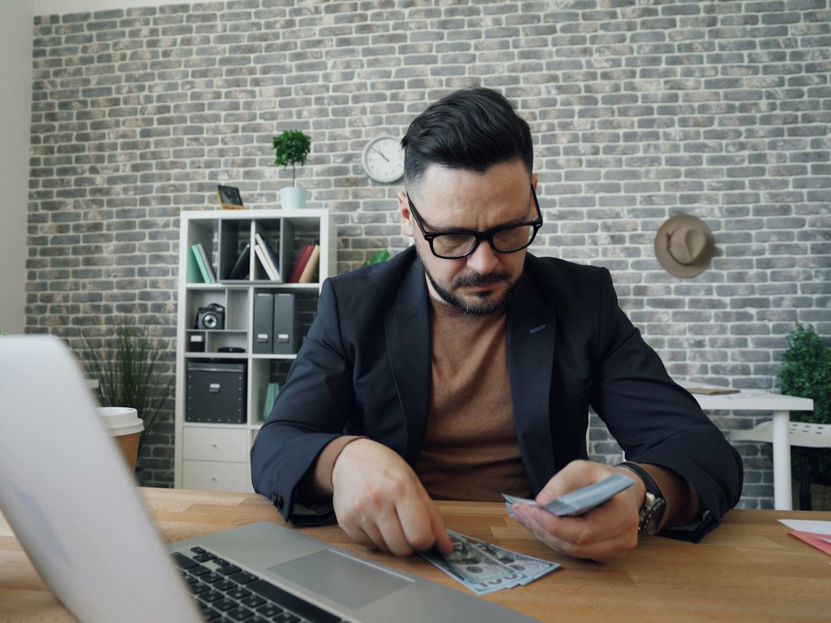 Professional reviewing accounts at his desk