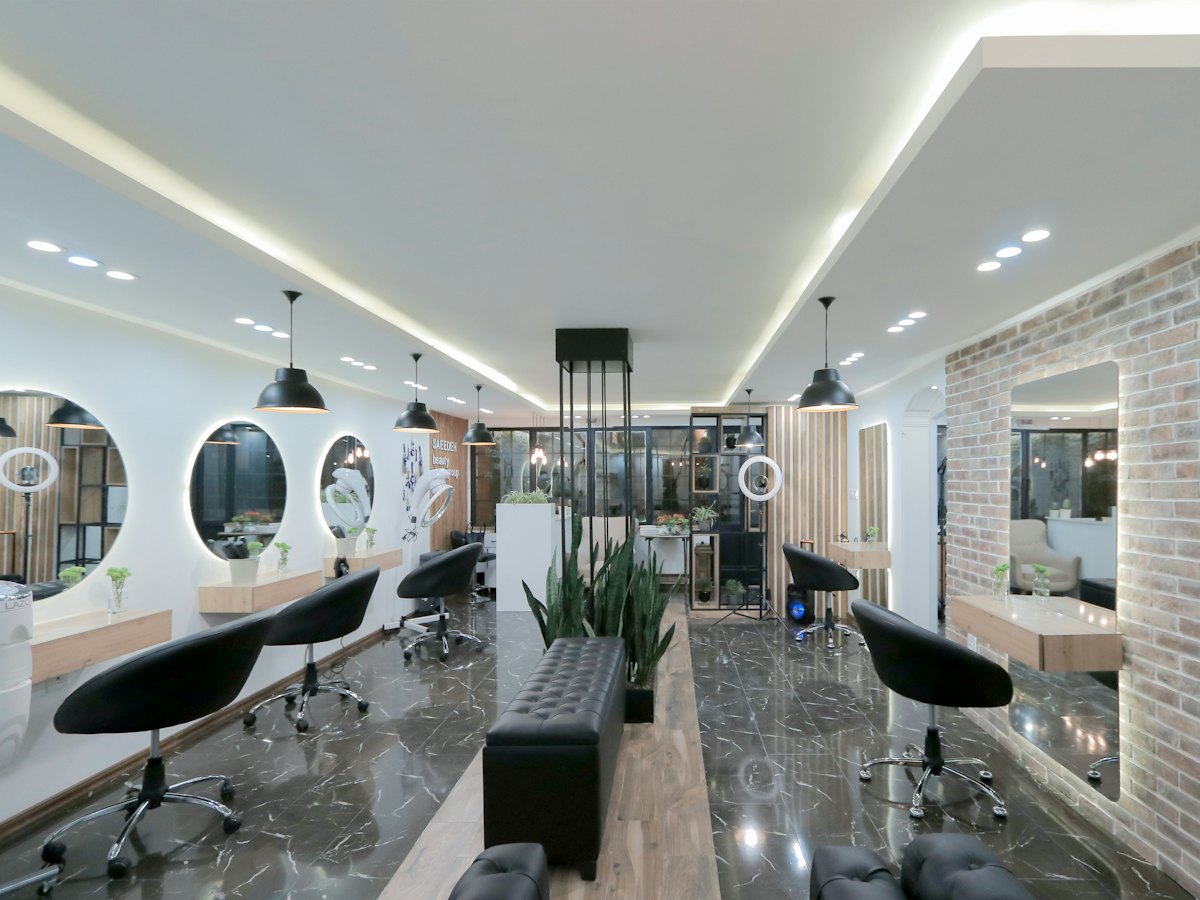 Modern salon with styling chairs and round mirrors